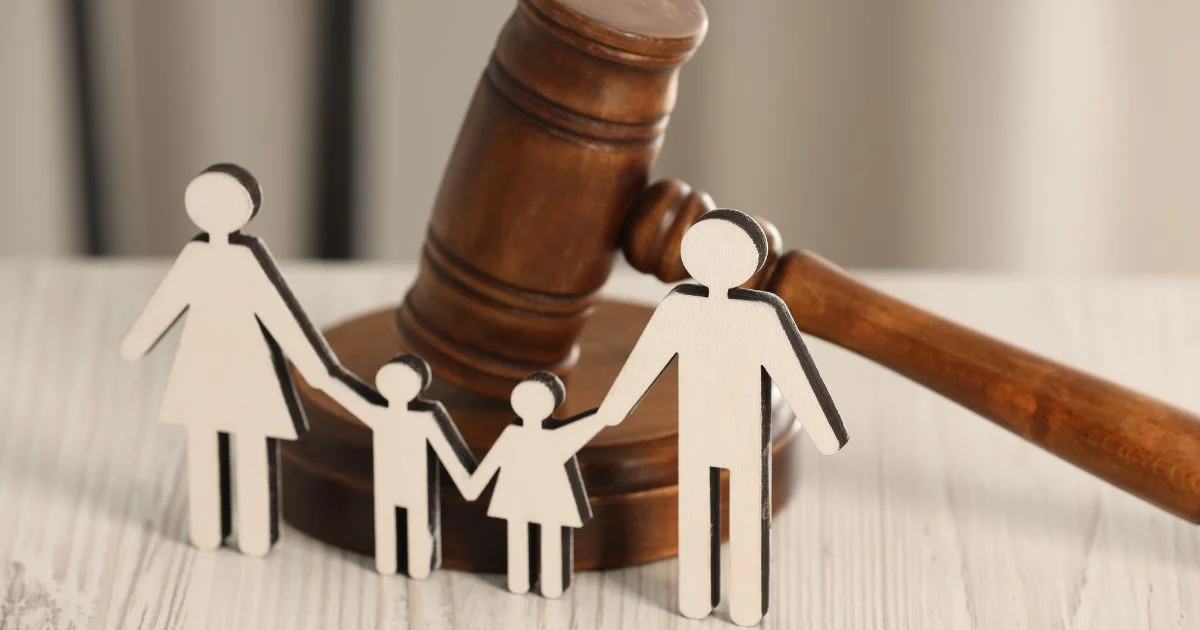 Family law concept with gavel and paper family figures